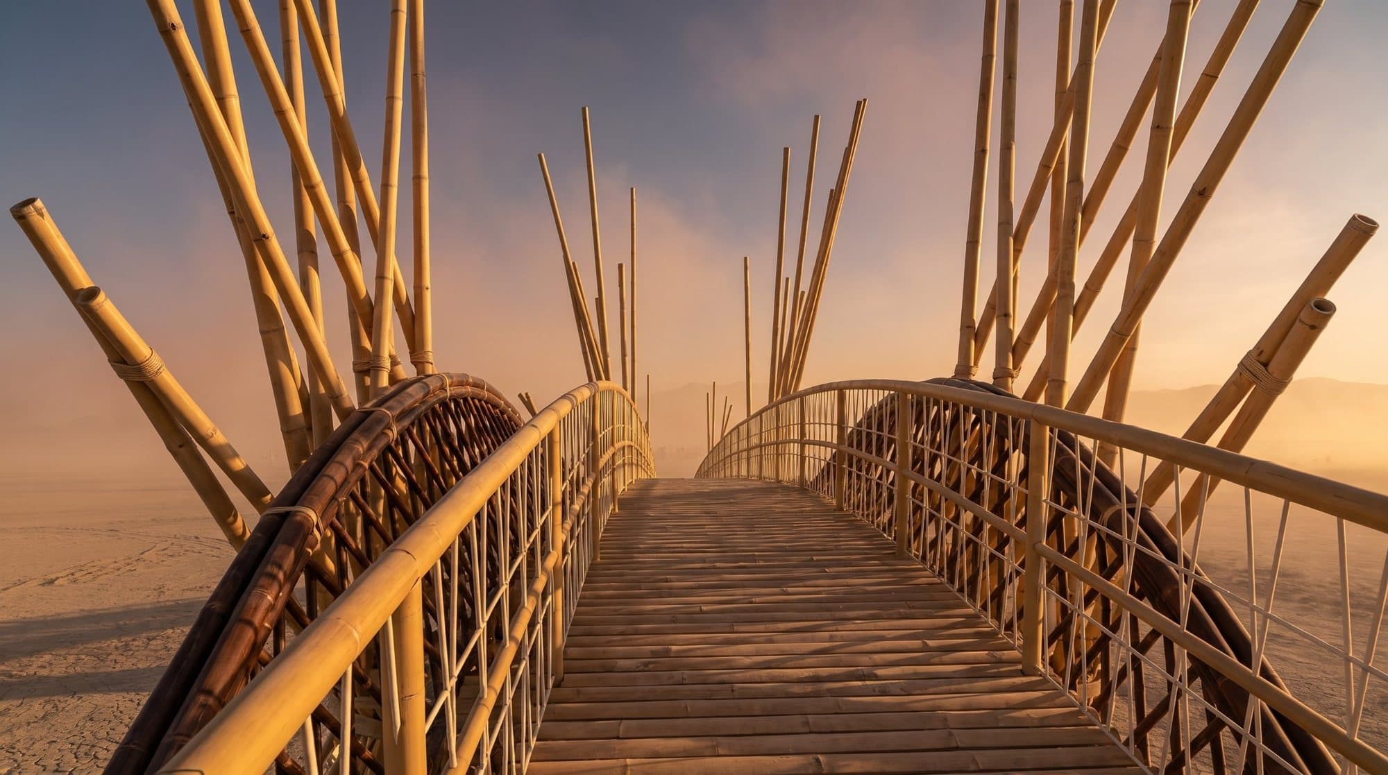 On the deck of the bridge: the walkway with net handrails between fanned bamboo towers