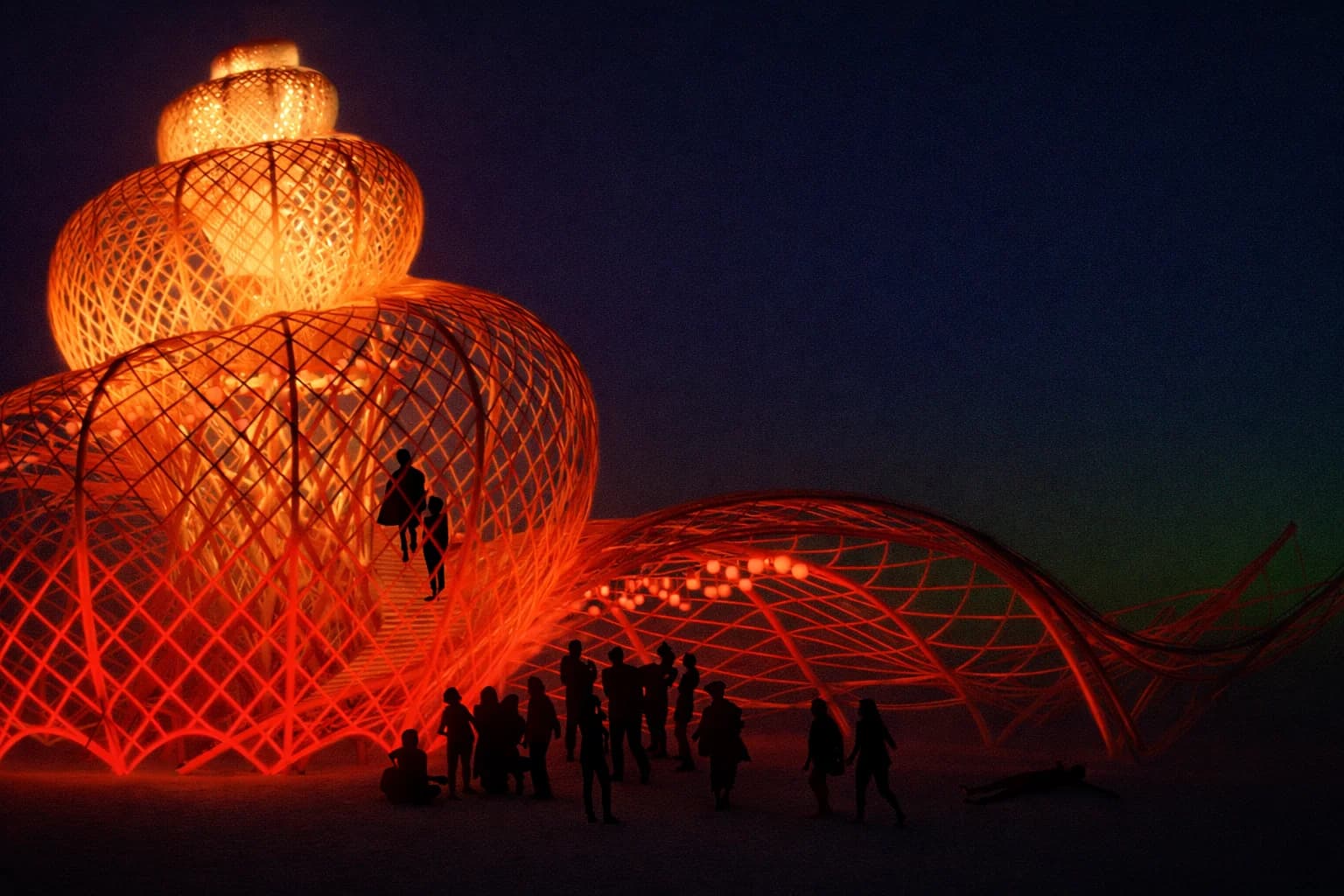 The Resonance Conch glowing at night, its spiral of bamboo lit from within